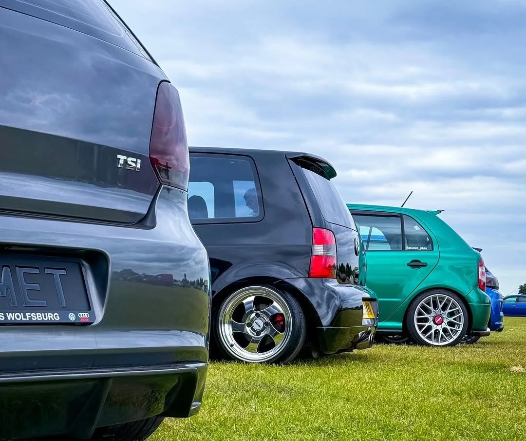 Modified Volkswagens parked together at a car meet